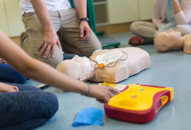 A CPR dummy being used in CPR training