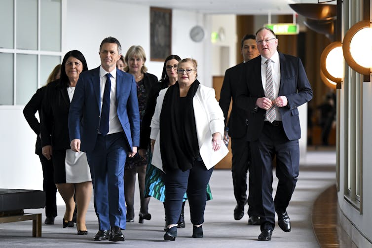 Federal Education Minsiter Jason Clare and his stage colleagues walking at Parliament House in Canberra.