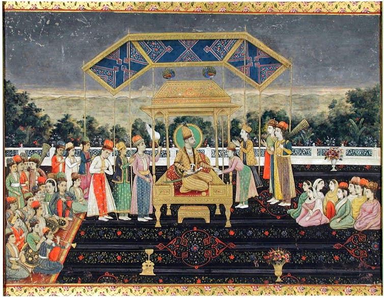 An ancient manuscript painting of a person on a throne surrounded by other people.