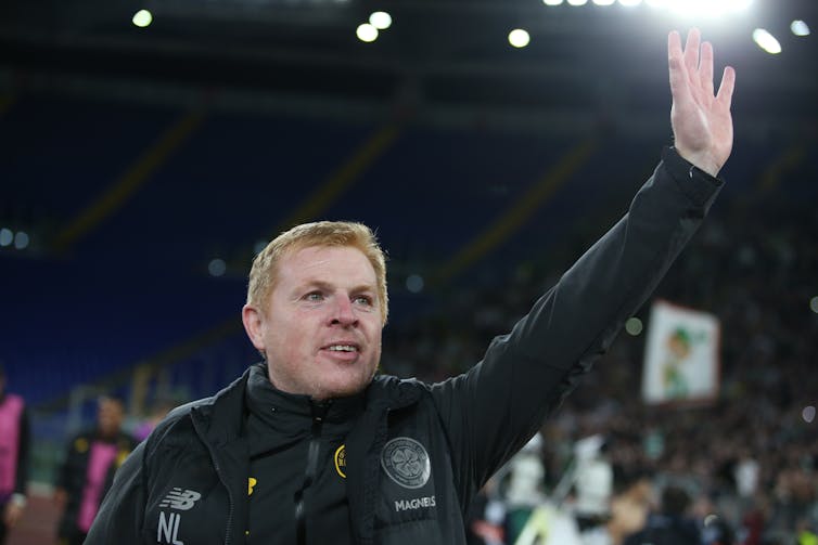 Man waving to the crowd