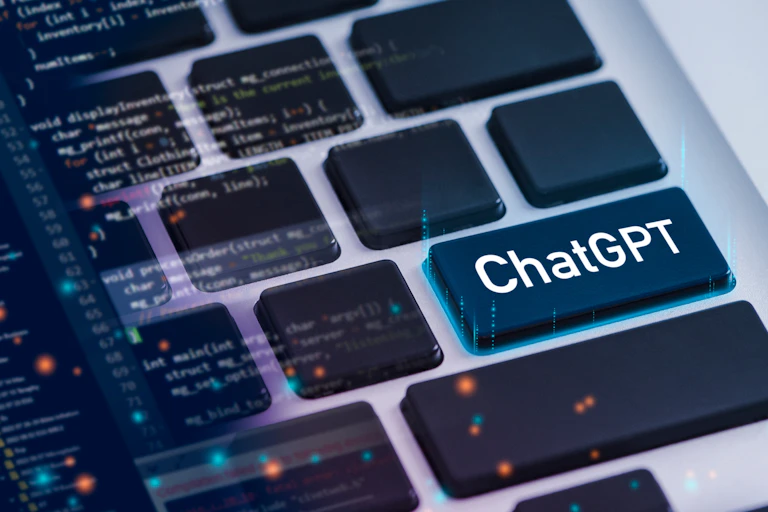 Close-up of a few buttons on a keyboard. One of the keyboards says 'ChatGPT' on it