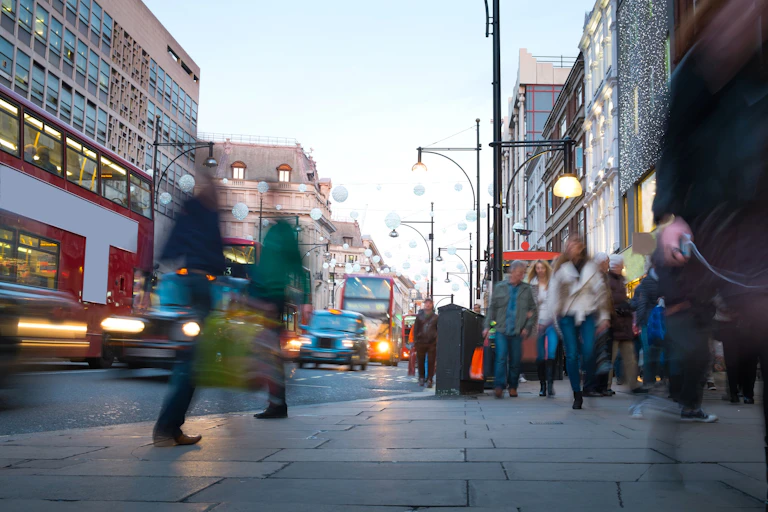Blurred crowds on a pavement.