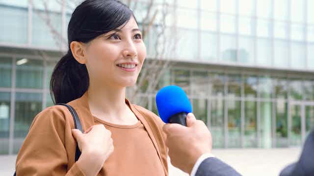 Woman being interviewed for the news