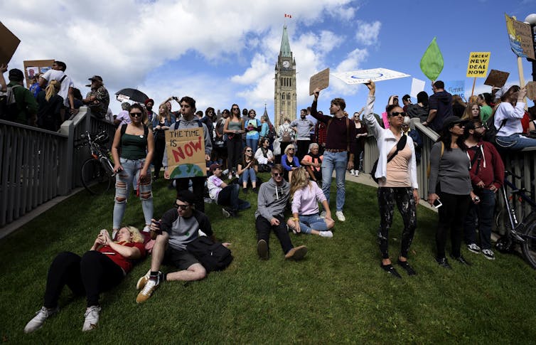 A group of young people seen at a climate change demonstration.