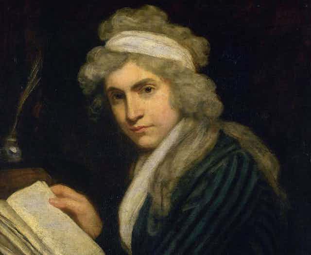 A painting of Mary Wollstonecraft holding a book but looking directly at the viewer.. 