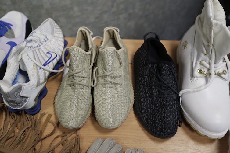 A row of sneakers sitting on a table