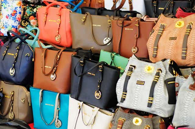 Counterfeit Michael Kors purses on display in a store