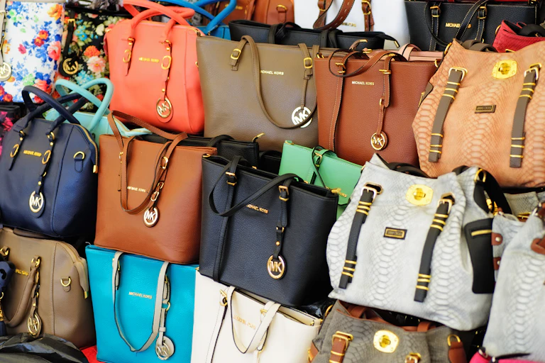 Counterfeit Michael Kors purses on display in a store