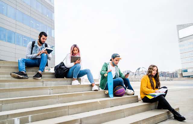 Students sitting on stairs.