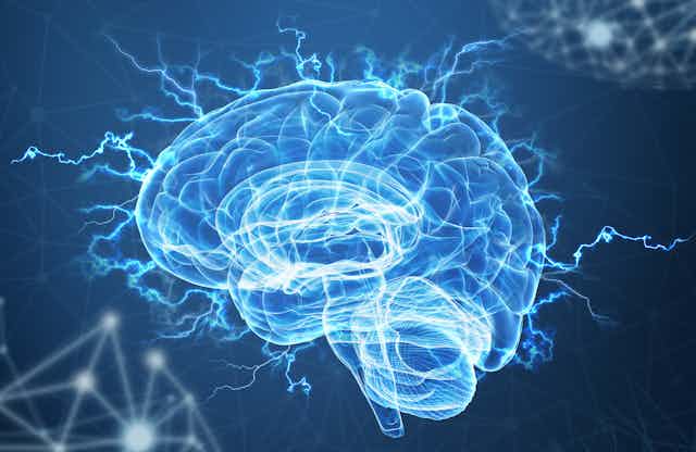 A translucent illustration of a brain on a blue background with electric currents streaming from it