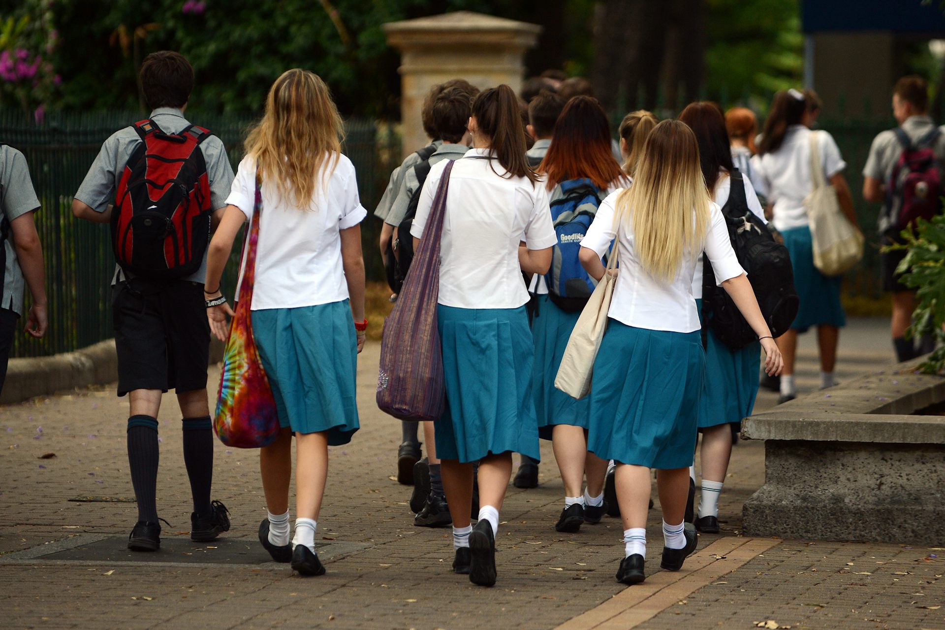 High school students walking along a footpath.