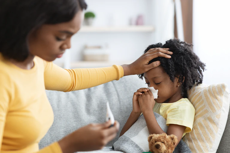 Mother taking child's temperature