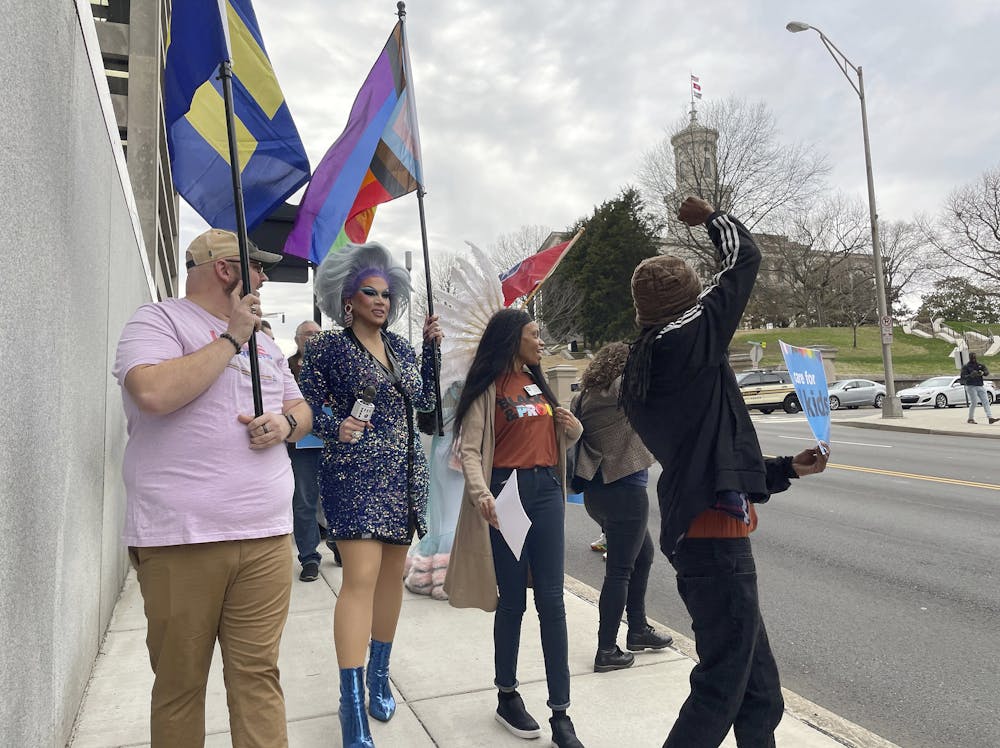 Protesters against a bill restricting drag shows march from a rally outside of the Tennessee Capitol in Nashville on Feb. 14, 2023