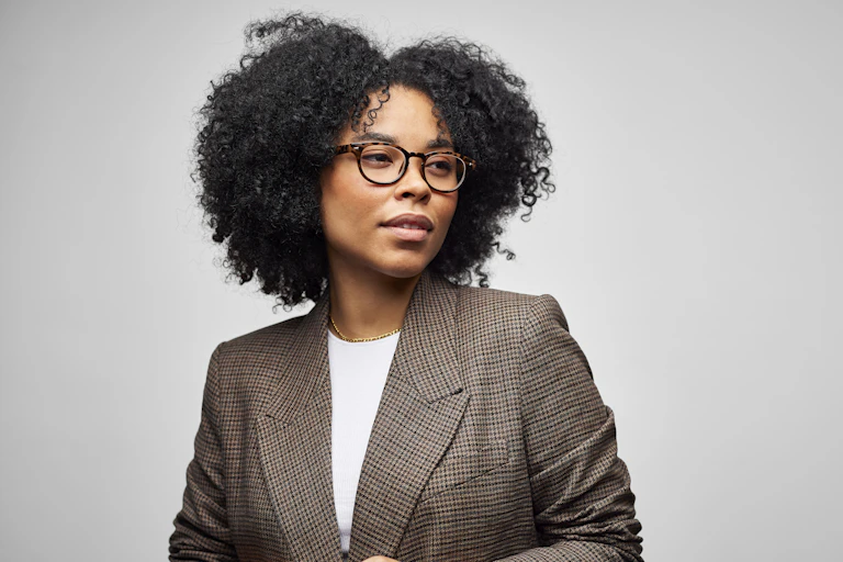 A Black woman in a blazer.