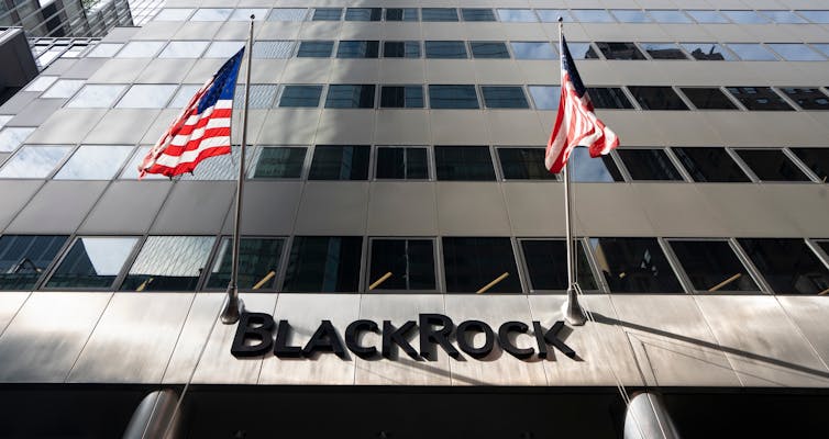 US company sign with two American flags