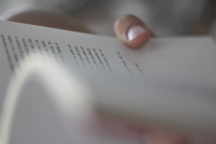 View of a book being held open.