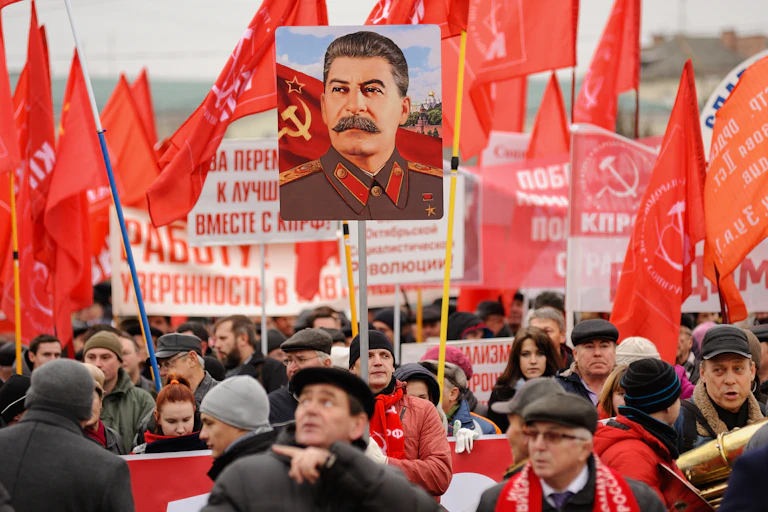 In Russia, a portrait of Staline emerges out of a communist gathering