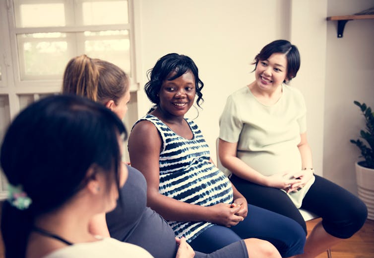 A group of pregnant women sitting together