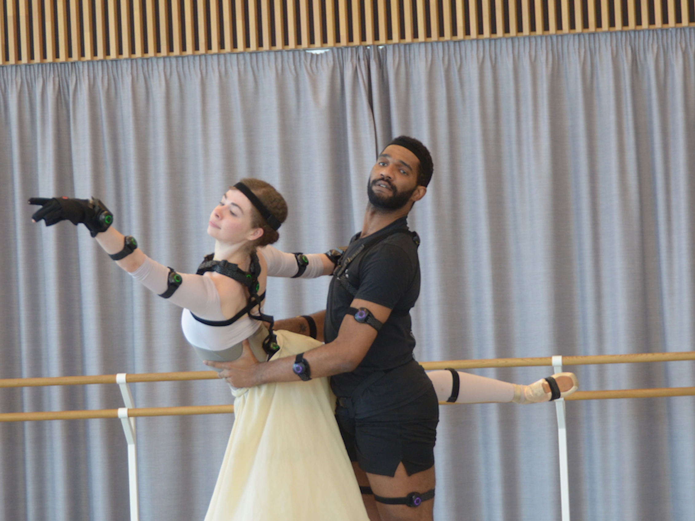 Junor Souza and Rebecca Blenkinsop wear the black strappy sensors while dancing.