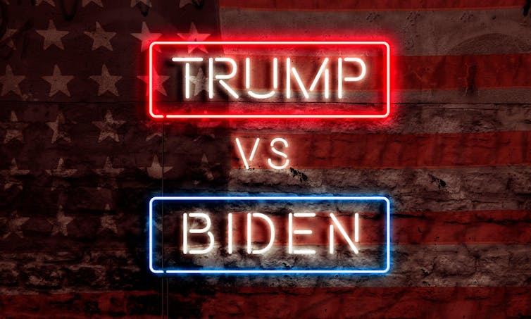 A neon signing showing the words Trump vs Biden.