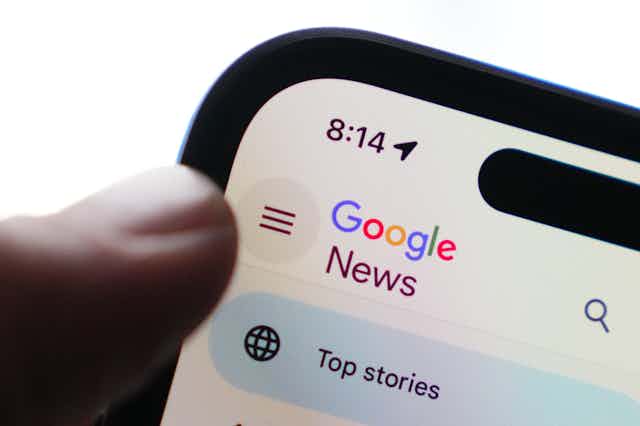 The Google News homepage is displayed on an iPhone.