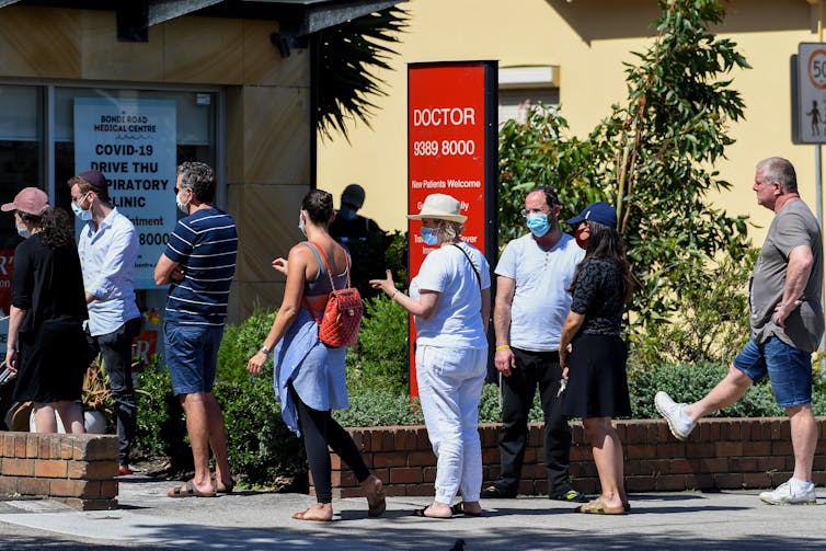 People queuing outside clinic for COVID testing