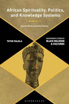 A book cover in black, brown and yellow with an image of an African statue of a head.