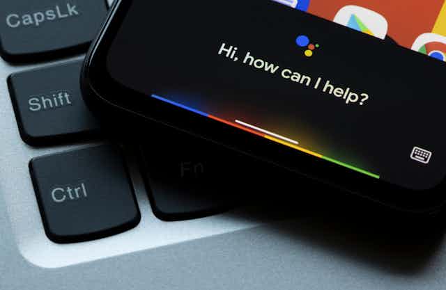 A smartphone displaying the words: how can I help