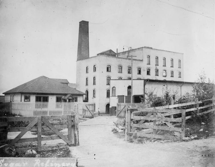 A black and white photo of old factory bulidings
