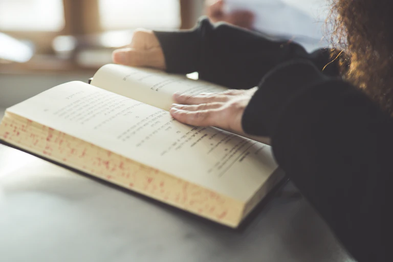A woman reads a Jewish holy book