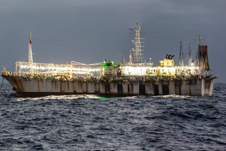 Fishing vessel with lamps to attract squid