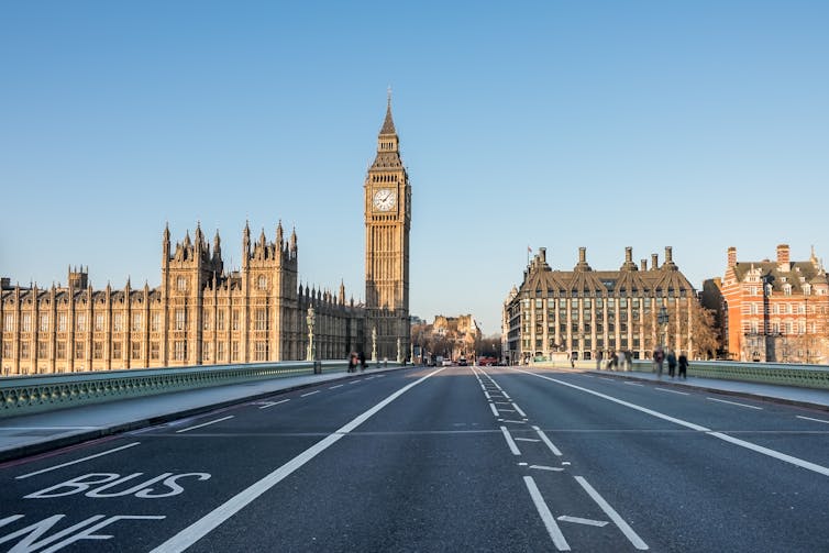 Empty Westminster Bridge with the Houses of Parliament and the Big Ben in the background.