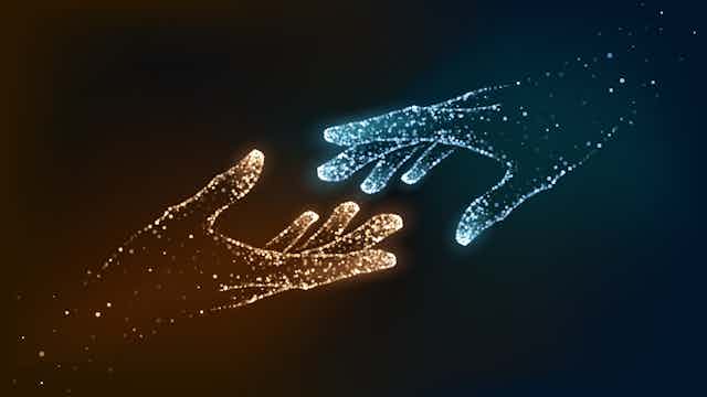 two digital hands — one yellow and one blue — reach out to touch