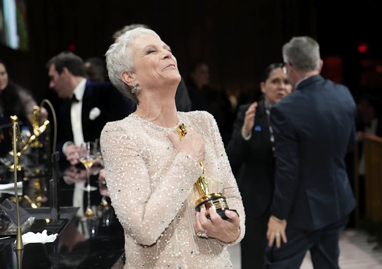 ‘Nepo baby’ Jamie Lee Curtis at an Oscars afterparty, with her Oscar.John Locher/ AP