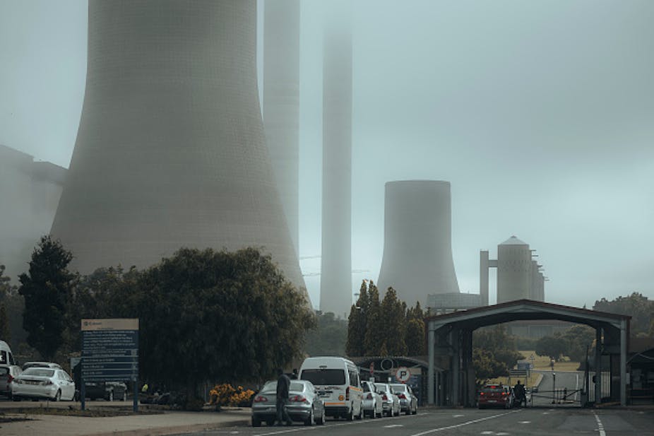 A foggy image of a coal power plant 