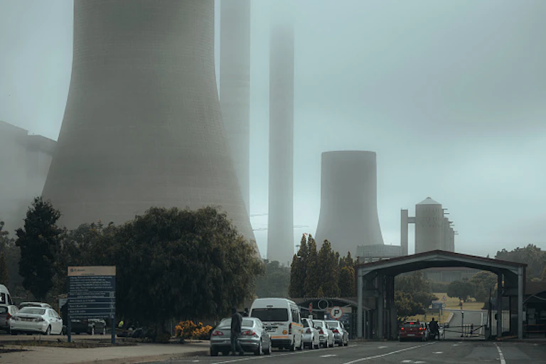 A foggy image of a coal power plant