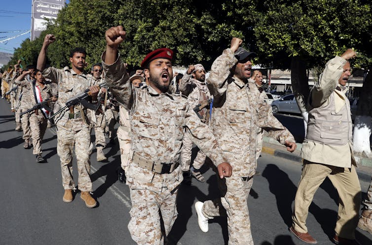 Houthi rebels march in Sana'a, Yemen.