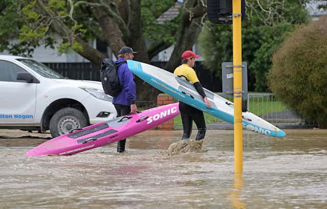 Surf lifesavers get ready to check houses in flooded streets