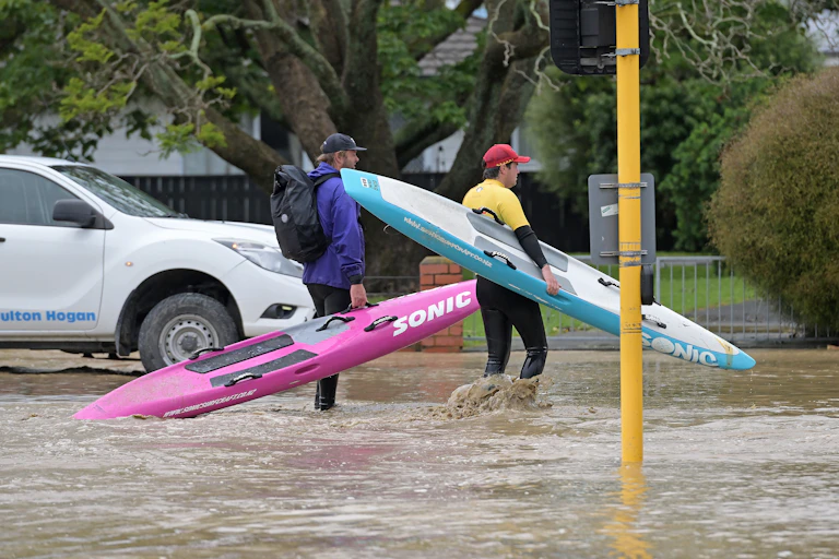 Surf lifesavers get ready to check houses in flooded streets