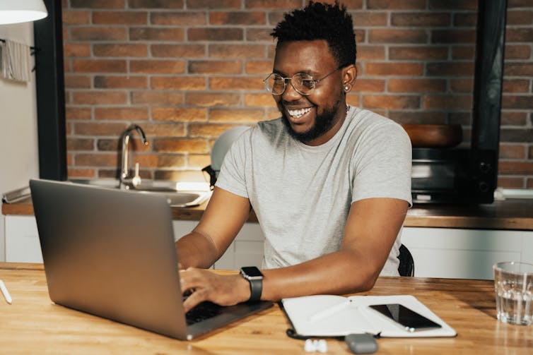 Man working from home on a laptop.