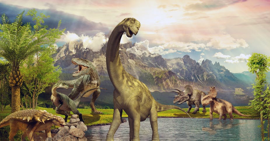 3D rendering of dinosaurs by a lake near mountains