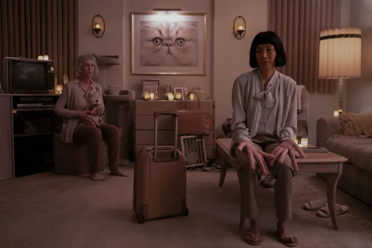 Jamie Lee Curtis and Michelle Yeoh with long sausage-like fingers.