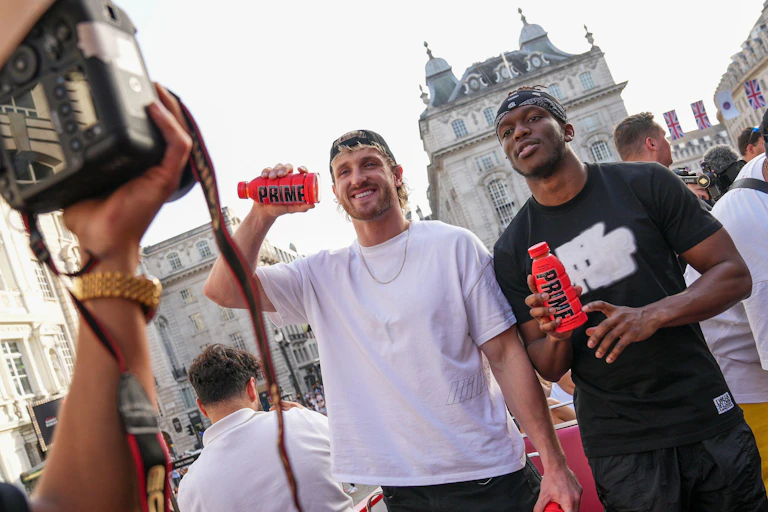 Logan Paul and KSI promoting Prime on board an open top bus.