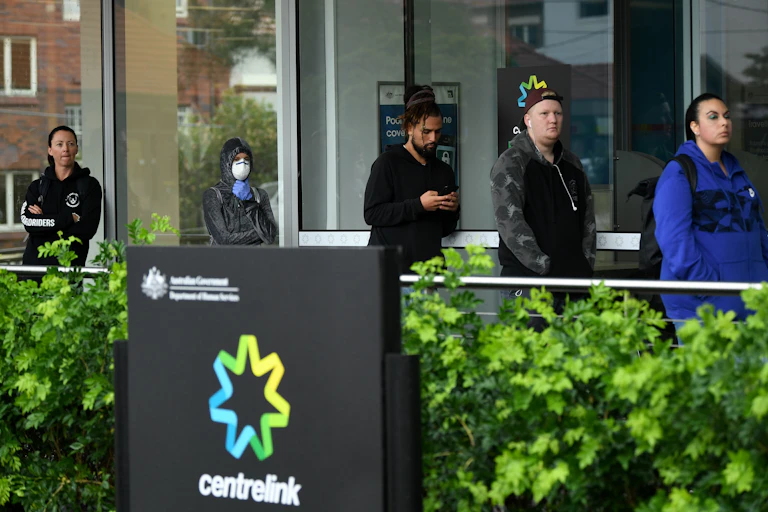 People queuing outside a Centrelink office