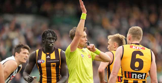 An umpire blows his whistle for dissent during the AFL Round 12 match between the Hawthorn Hawks and the Collingwood Magpies at the Melbourne Cricket Ground in Melbourne, Sunday, June 5, 2022