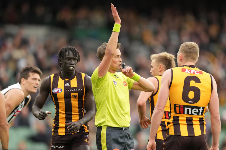 An umpire blows his whistle for dissent during the AFL Round 12 match between the Hawthorn Hawks and the Collingwood Magpies at the Melbourne Cricket Ground in Melbourne, Sunday, June 5, 2022