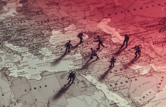 A concept map of the Middle East with toy soldiers