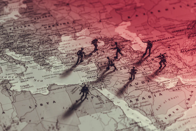 A concept map of the Middle East with toy soldiers