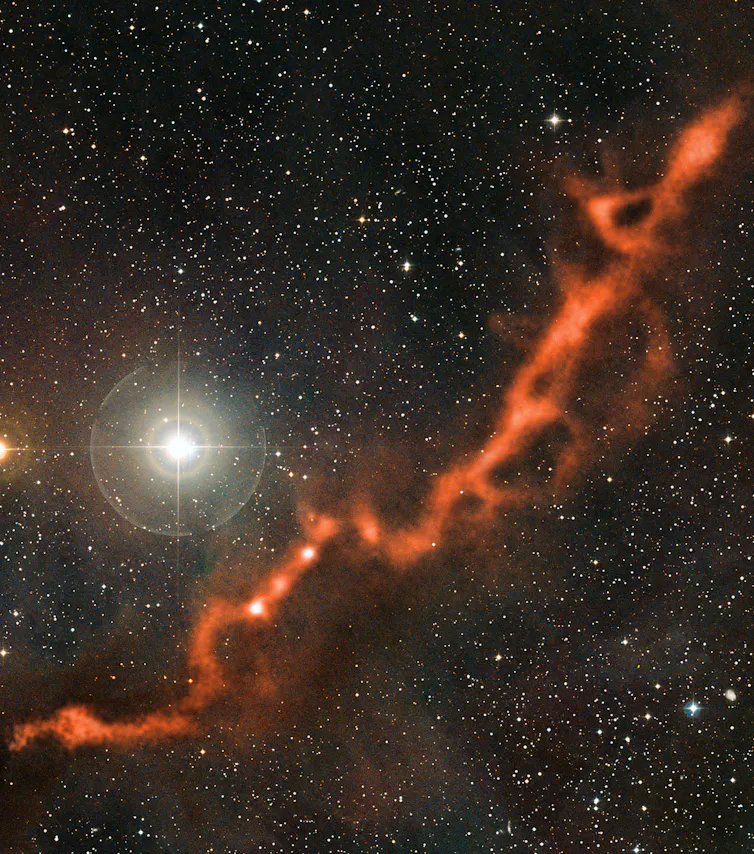 A cloudy filament against a backdrop of stars.