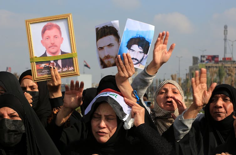 Women protest detained relatives in Baghdad.